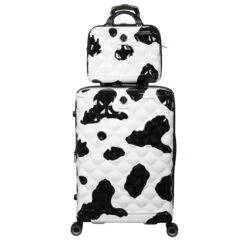 IT Luggage Indulging - 4pc Set (Moo Cow Print) 32 IT Luggage Indulging - 4pc Set (Moo Cow Print) -Travel Storage 33198 UK16 3039A08 16 3039A15Moocowblack whiterepeatprintSSFrontpanel25in